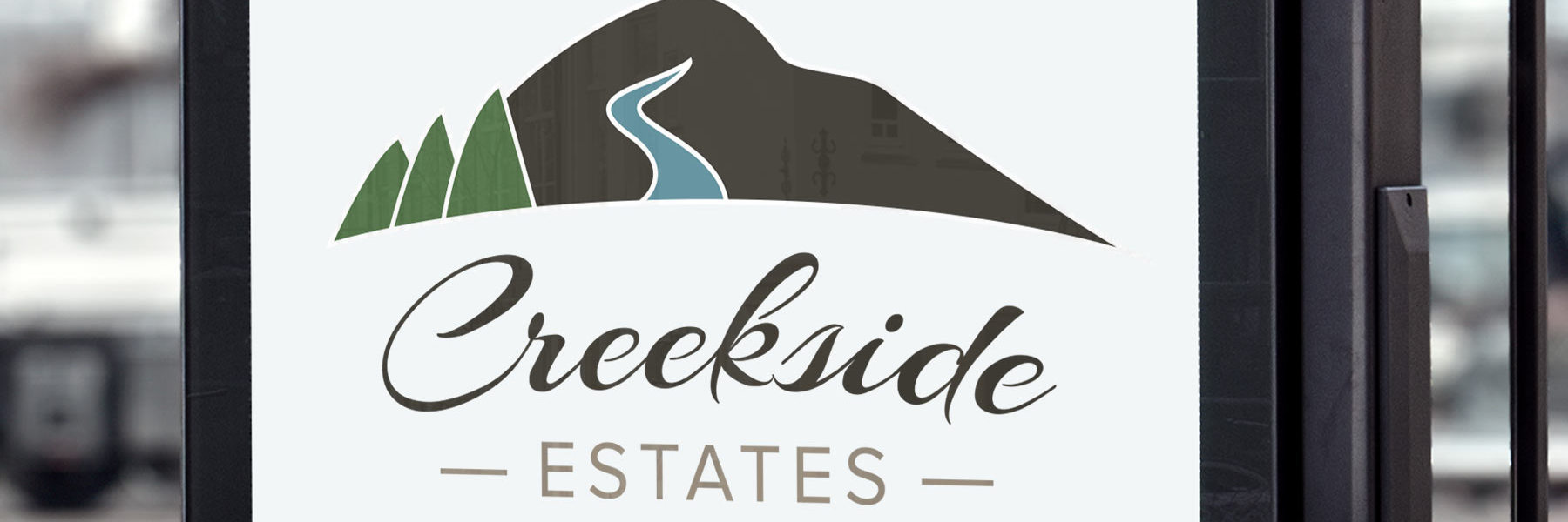 Creekside Estates logo on sign