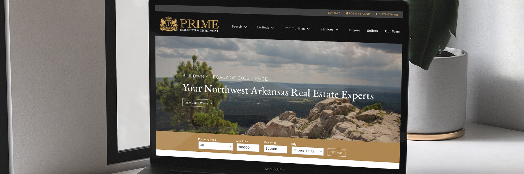Prime Real Estate & Development website homepage on laptop
